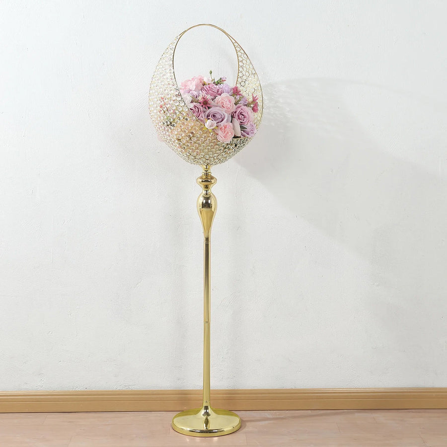 Elegant gold floor lamp with floral arrangement in a decorative basket.