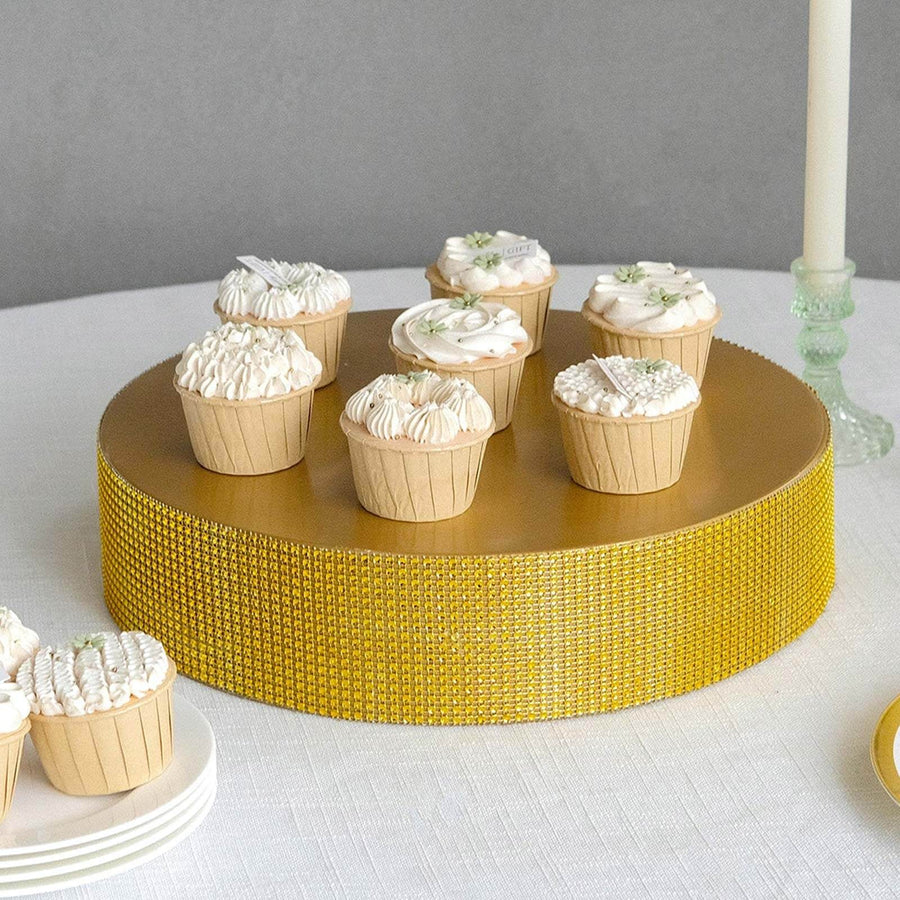 Decorative cupcakes on a gold cake stand for a celebration.