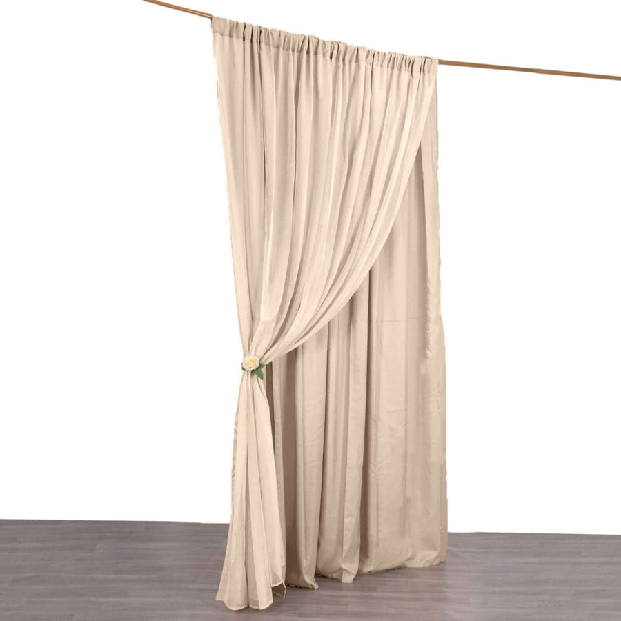 Beige curtain draped elegantly with tieback on a white background