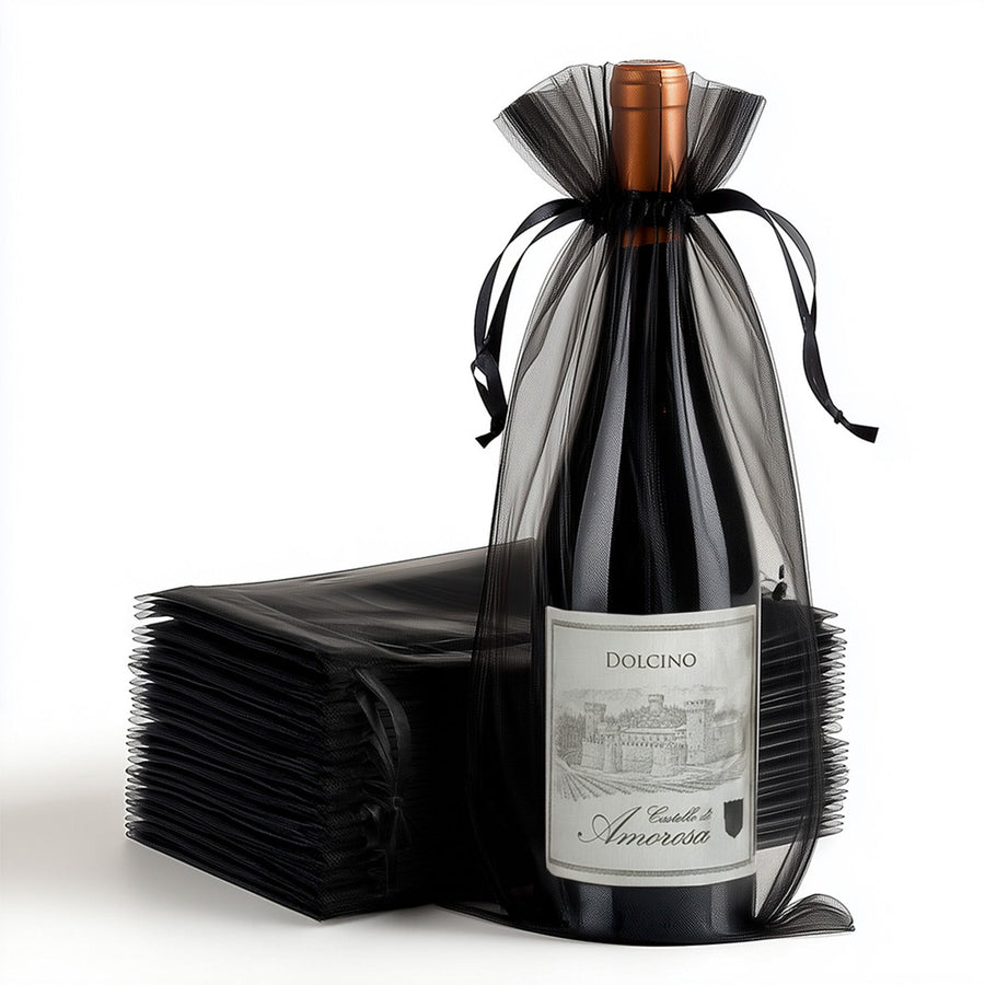 Dolcino wine bottle wrapped in black tulle with a stacked backdrop