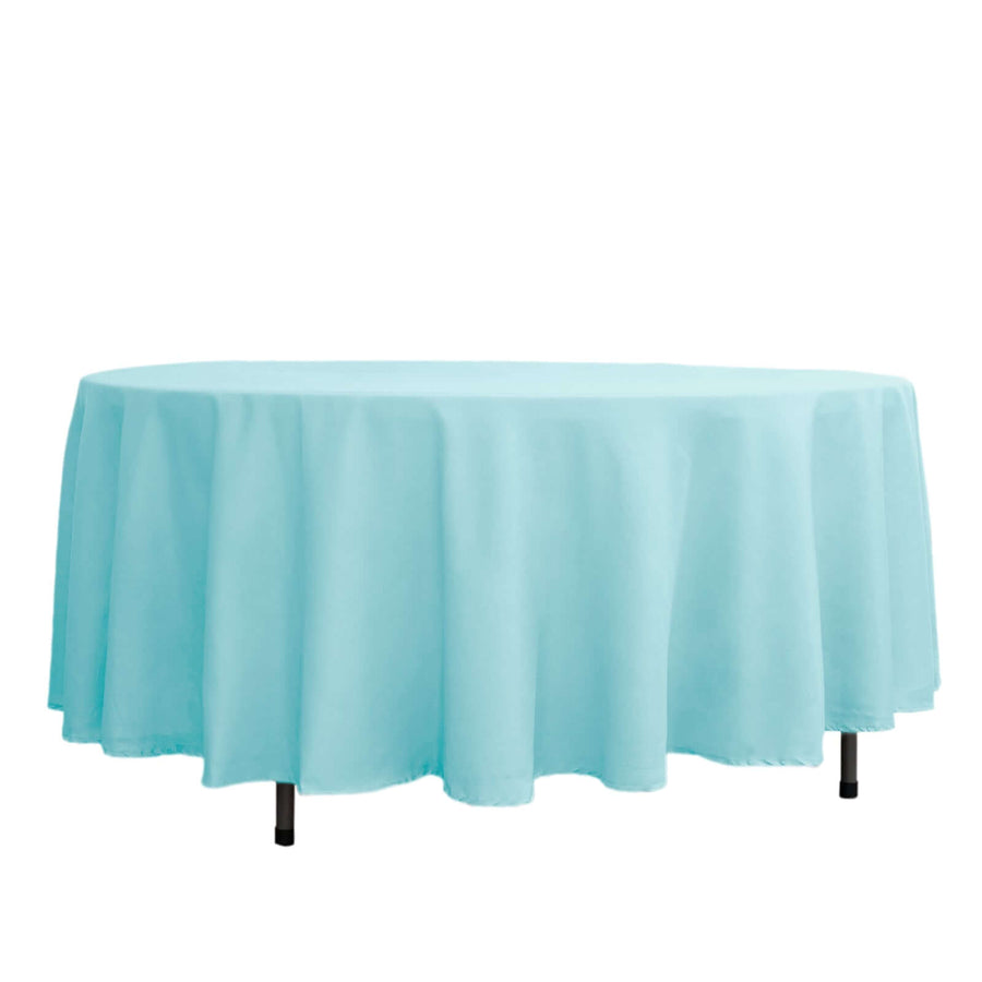 Light blue round tablecloth on a table.