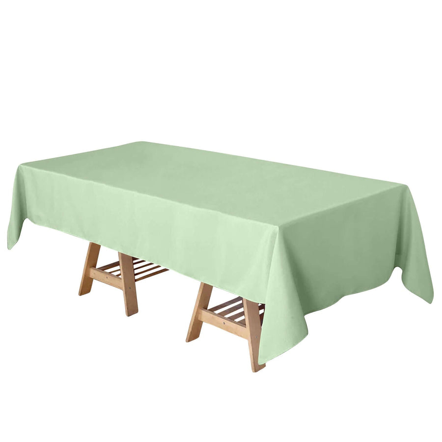 Light green tablecloth on a wooden table