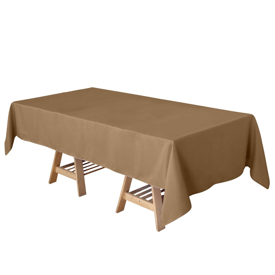 Brown tablecloth draped over a wooden folding table