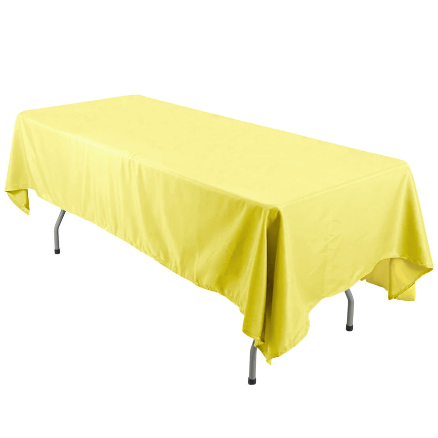 Yellow tablecloth draped over a folding table