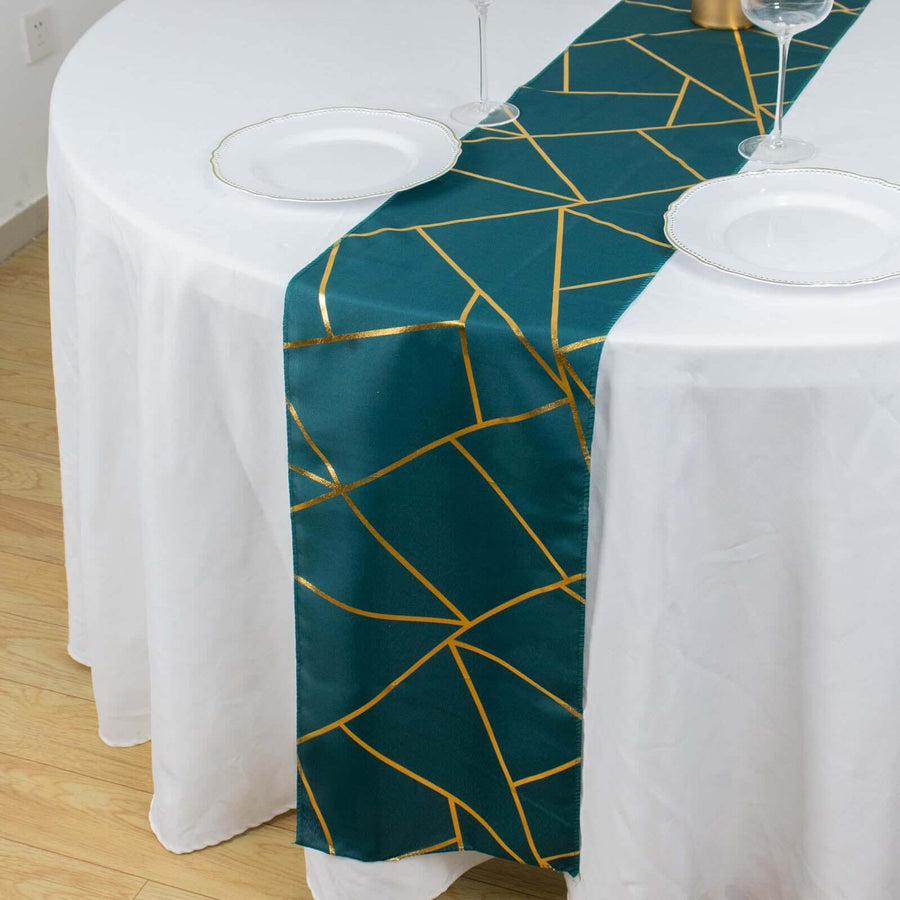 Teal table runner with gold geometric pattern on white table