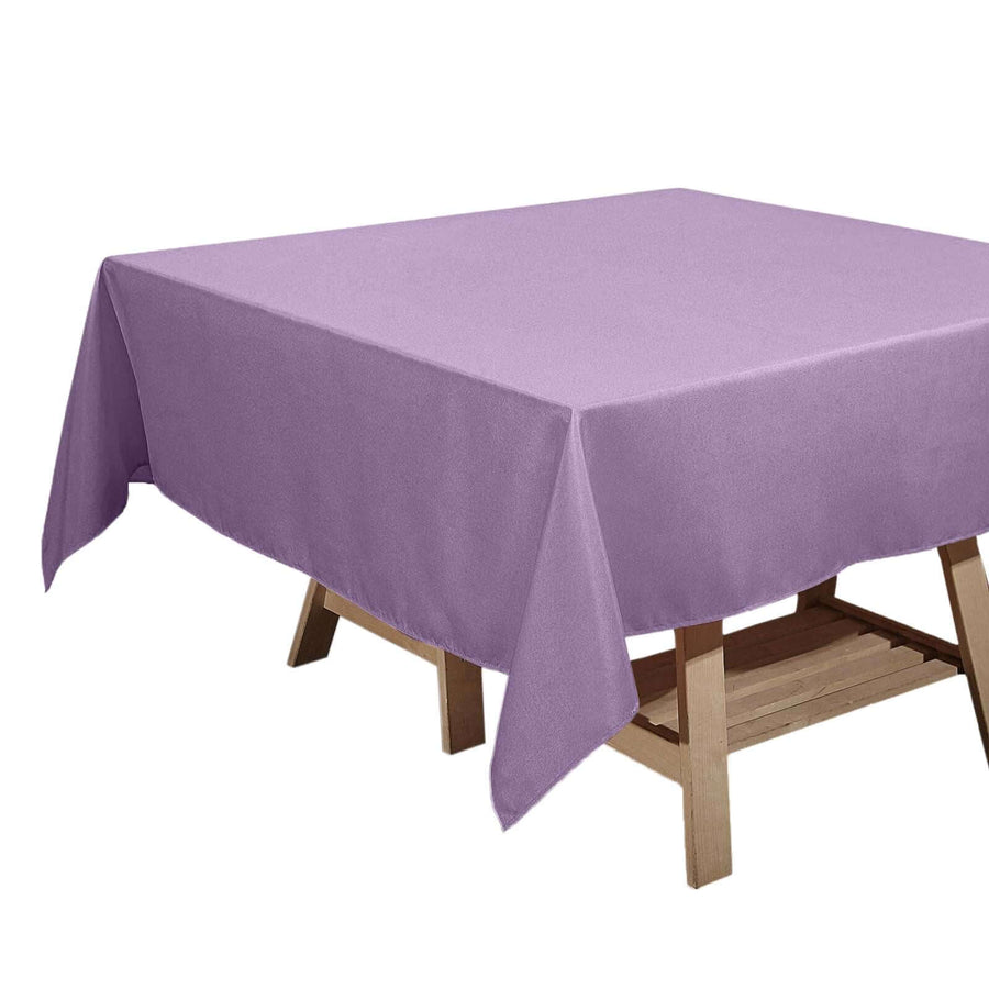 Purple tablecloth draping over a wooden table