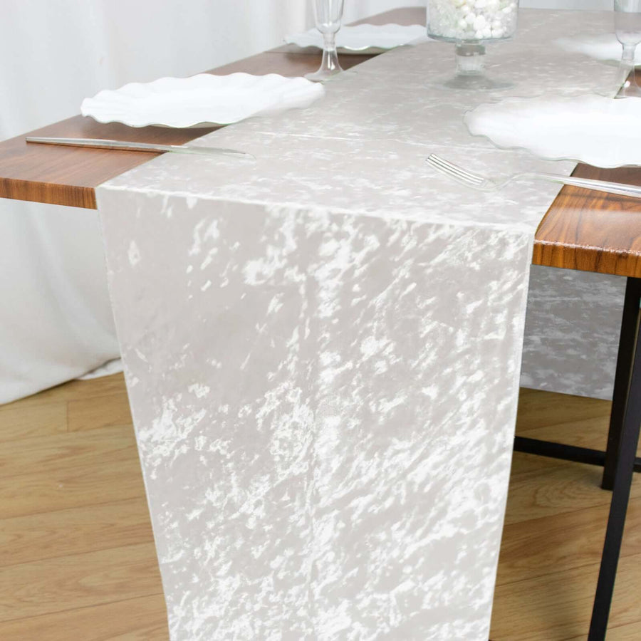 Elegant sheer table runner on a wooden dining table.