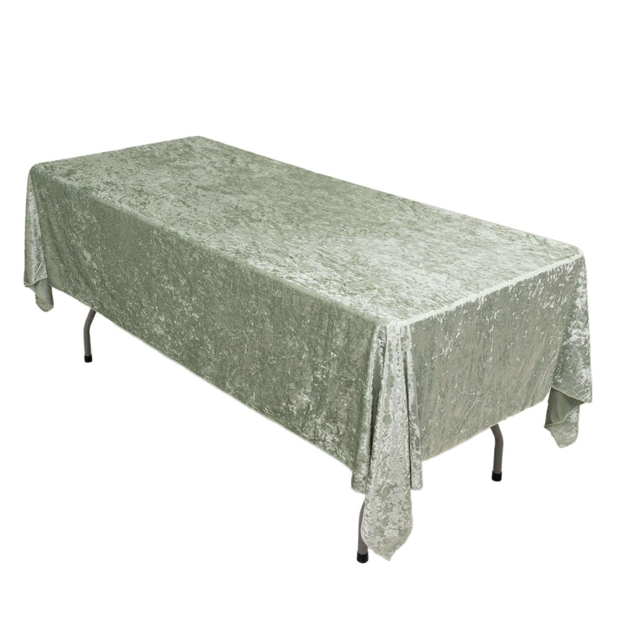 Green velvet tablecloth on a folding table.
