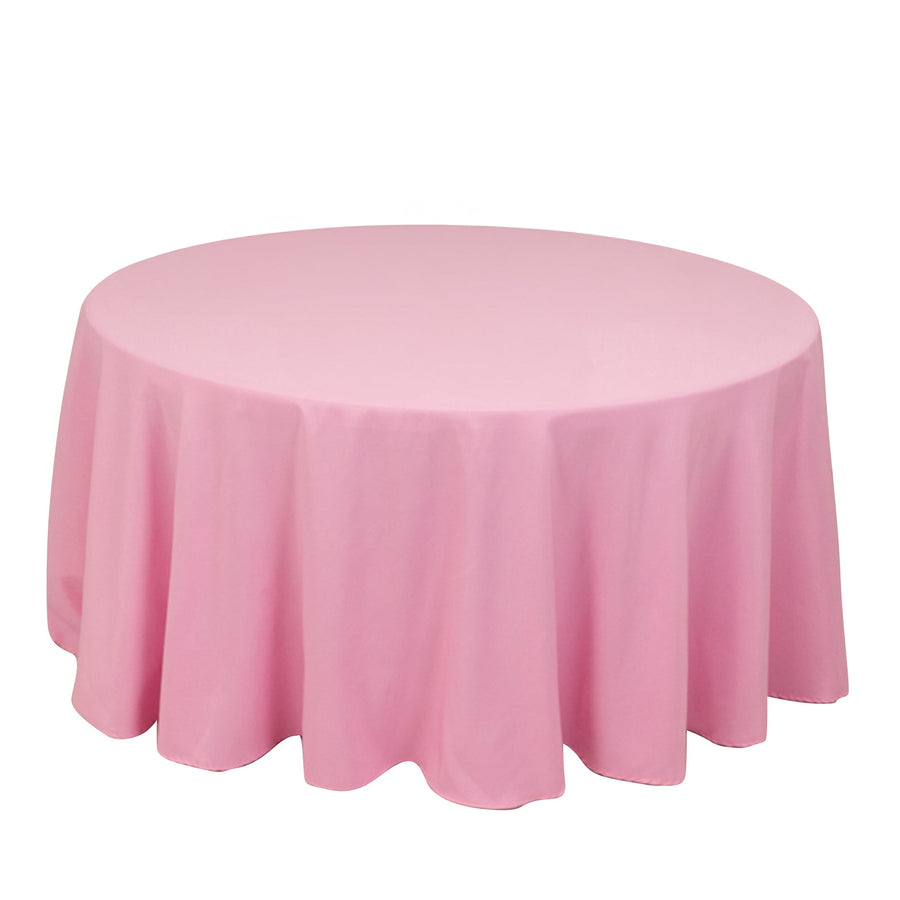Pink round tablecloth with elegant drape for events and decorations.