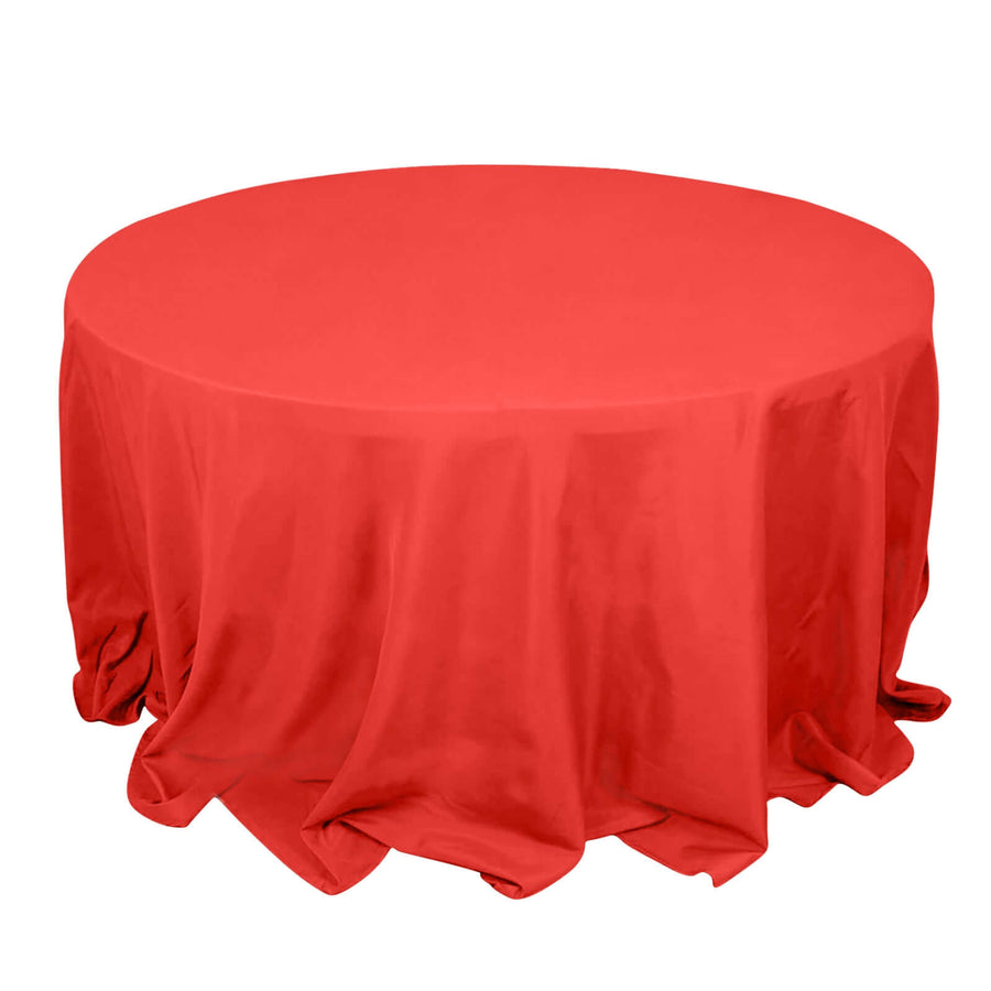 Red round tablecloth draped elegantly over a circular table.