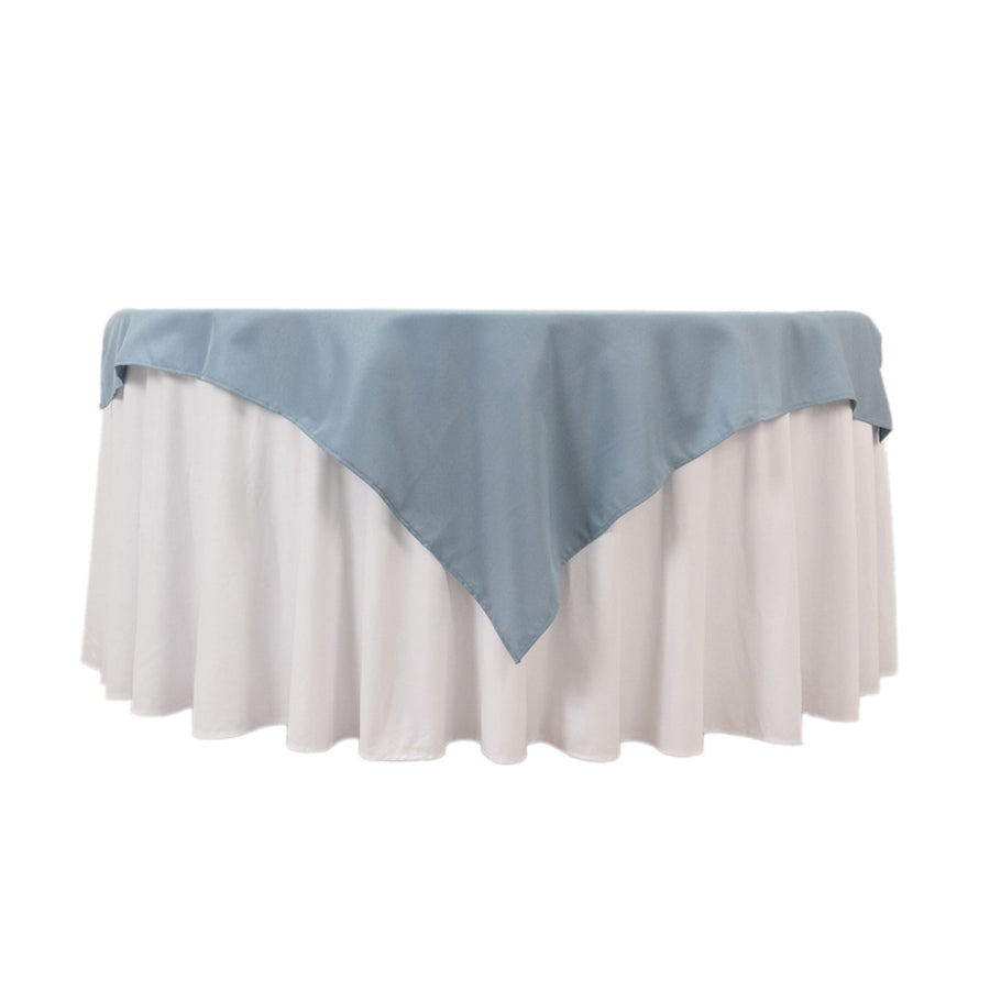 Blue and white tablecloth draped elegantly over a round table
