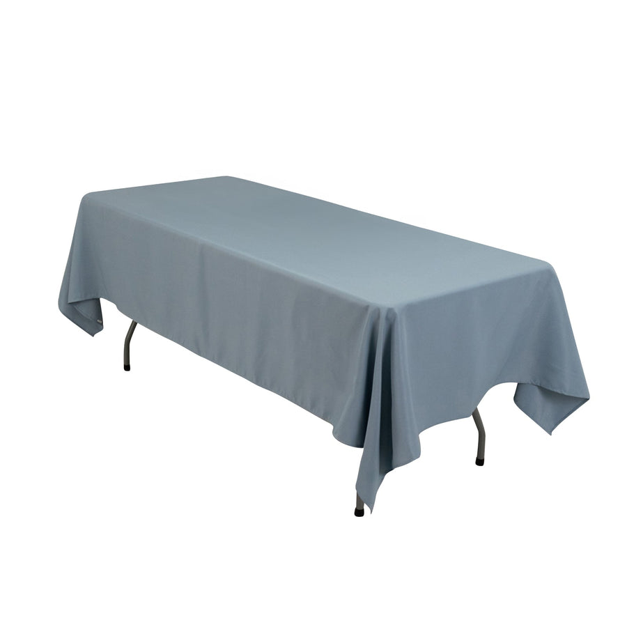 Blue tablecloth draped over a folding table in studio isolation.