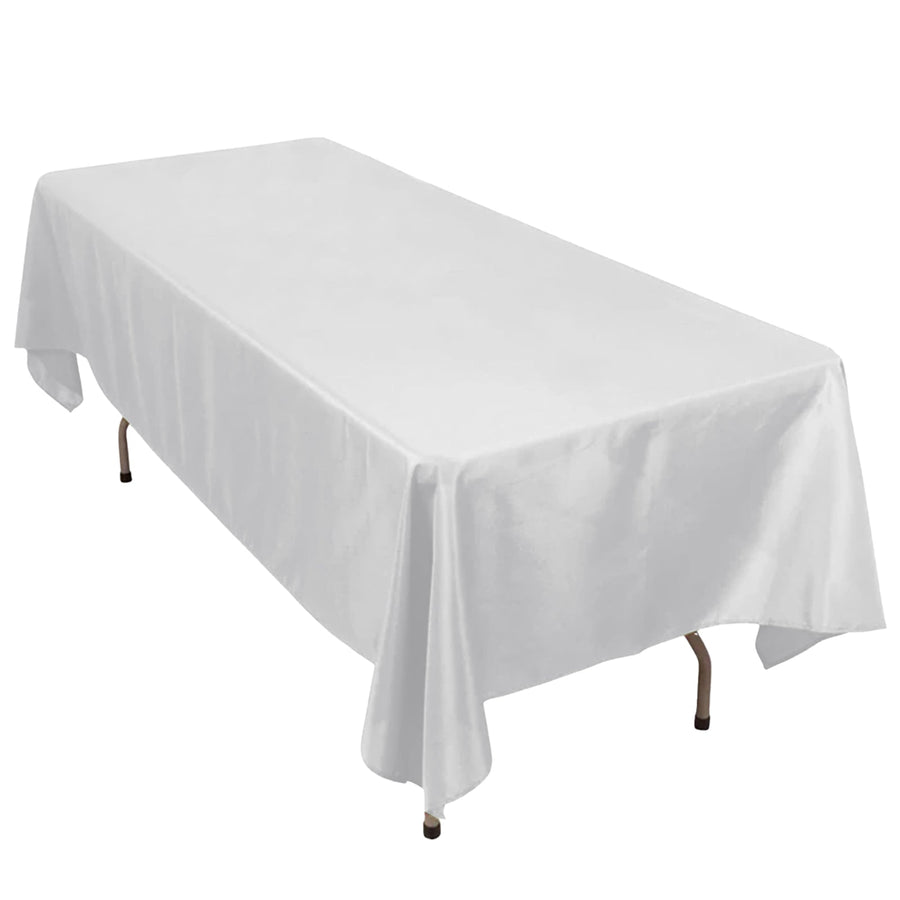 Rectangular white table covered with a smooth tablecloth