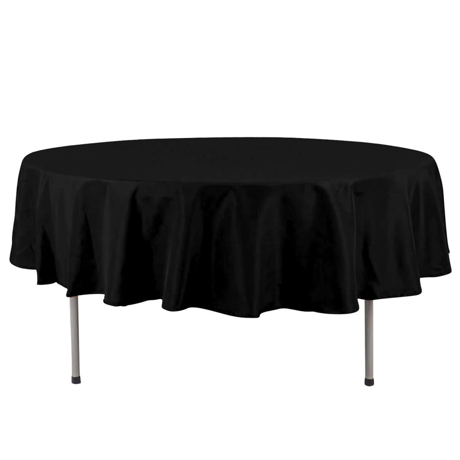 Black round tablecloth with elegant drape, suitable for various occasions.