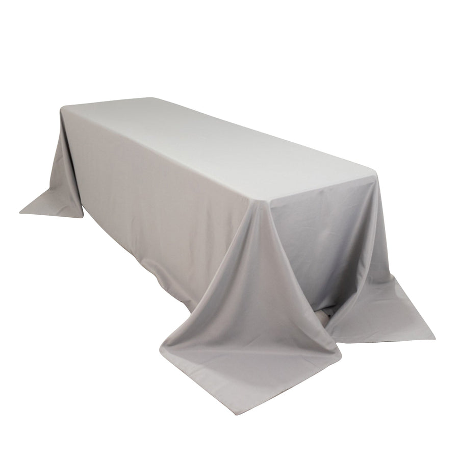 Gray tablecloth draped over a long table