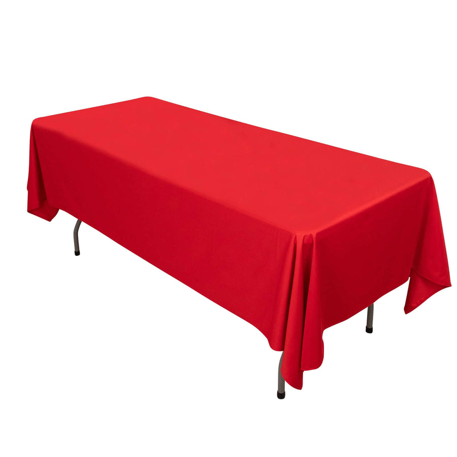 Red tablecloth draped over a rectangular table