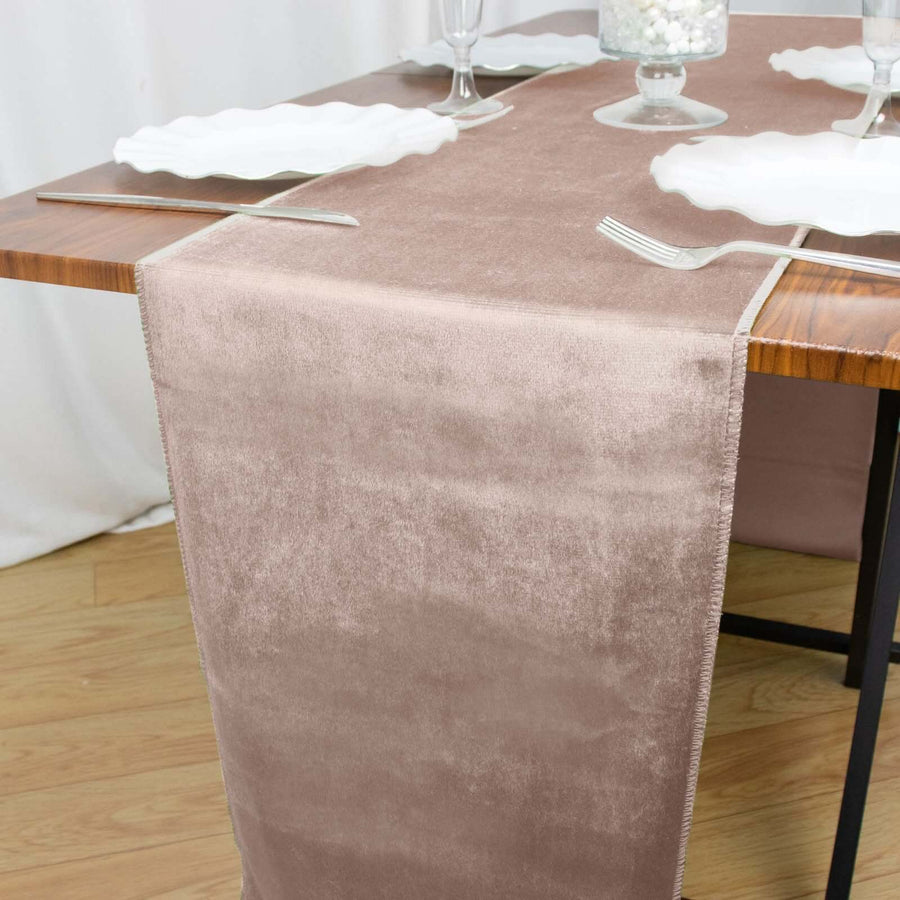 Elegant beige table runner on a dining table with plates and cutlery.