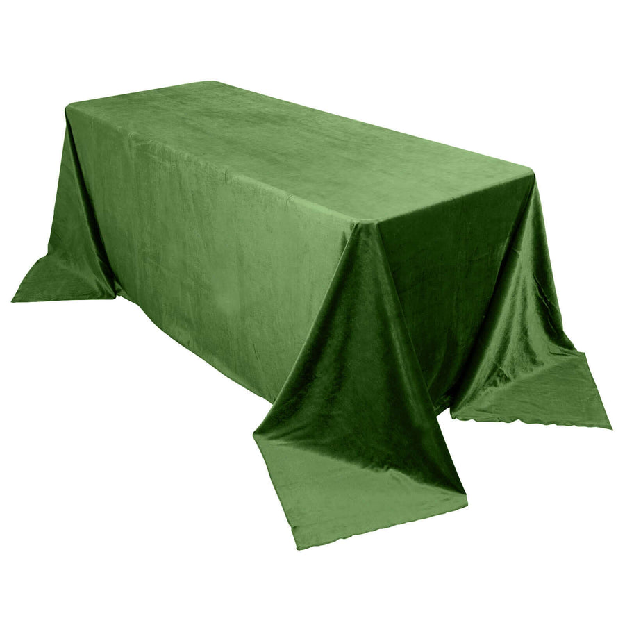 Green velvet tablecloth on a rectangular table