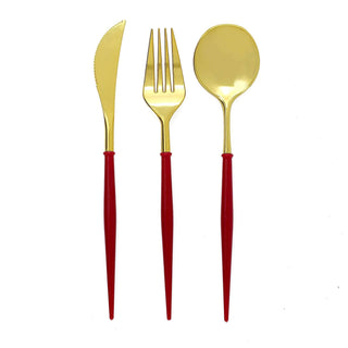 Gold cutlery set with red handles: knife, fork, and spoon.