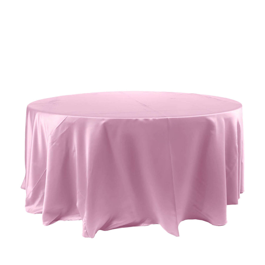 Pink round tablecloth draped elegantly over a table