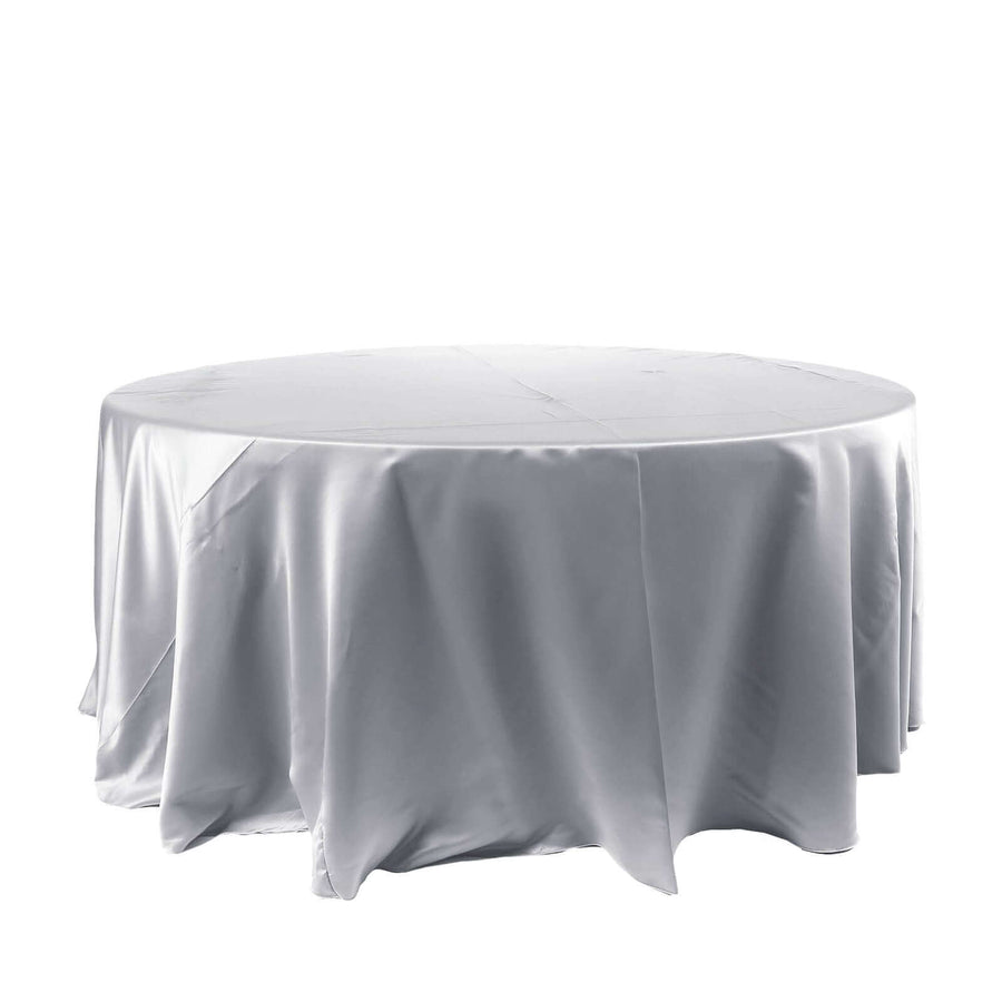 Round table covered with a smooth white tablecloth