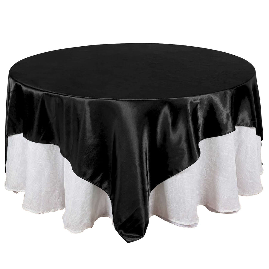 Black round tablecloth with white lace trim