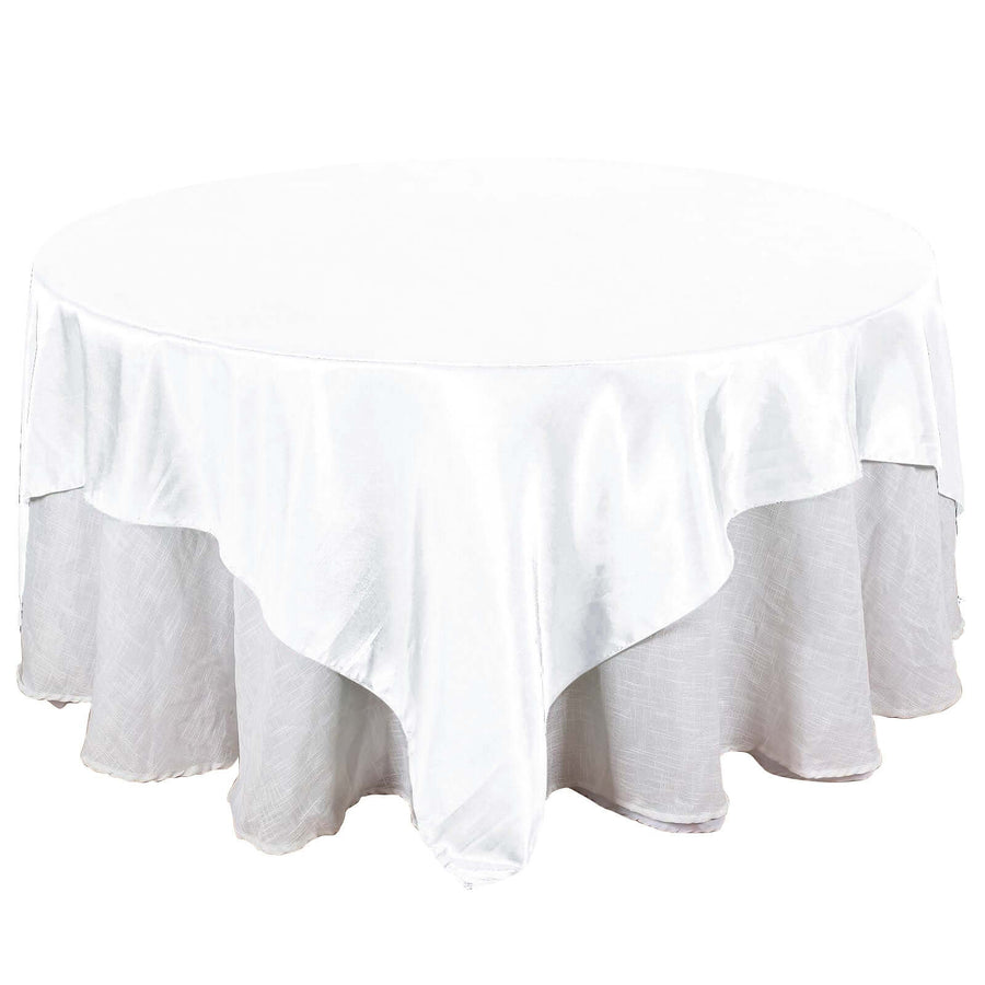 White round tablecloth with elegant drape and smooth texture.