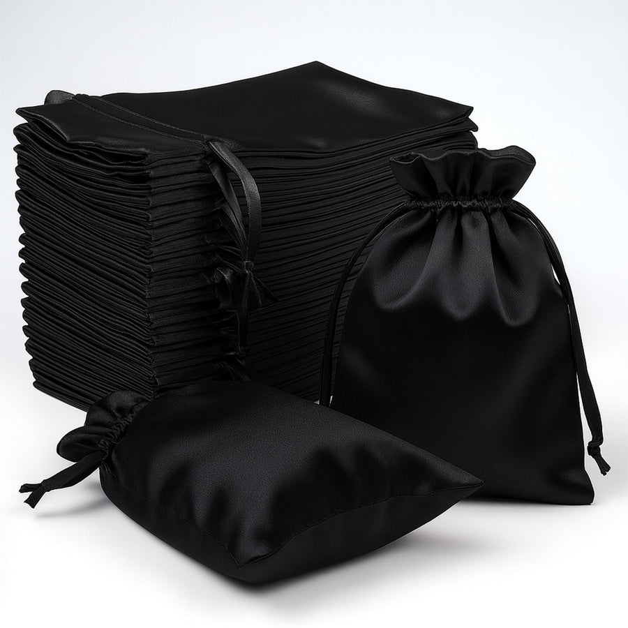 Black satin drawstring bags stacked on a white background.