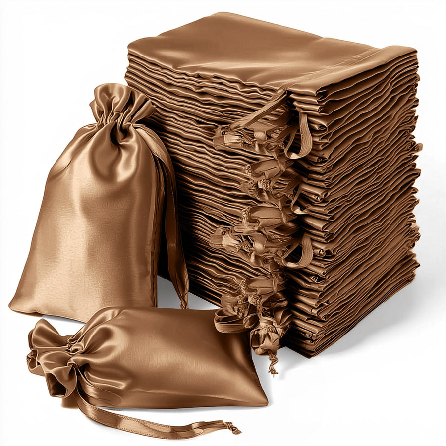 Stack of elegant brown satin drawstring bags on a plain white background.