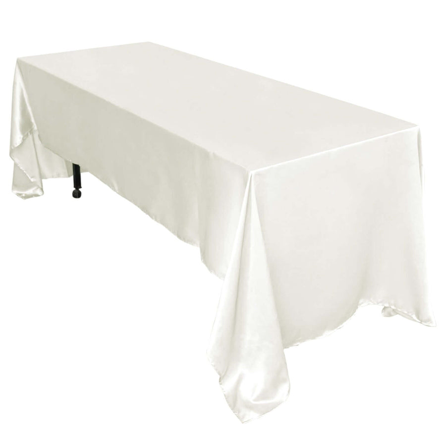 White satin tablecloth on a rectangular table