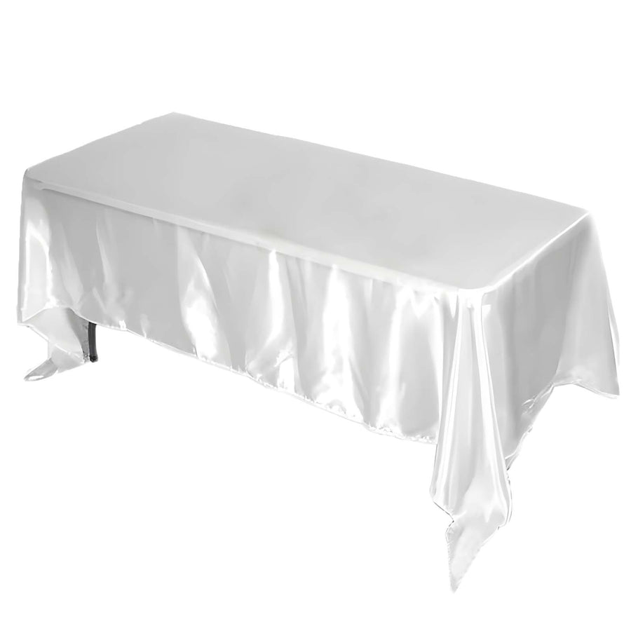 White satin tablecloth draped elegantly over a table