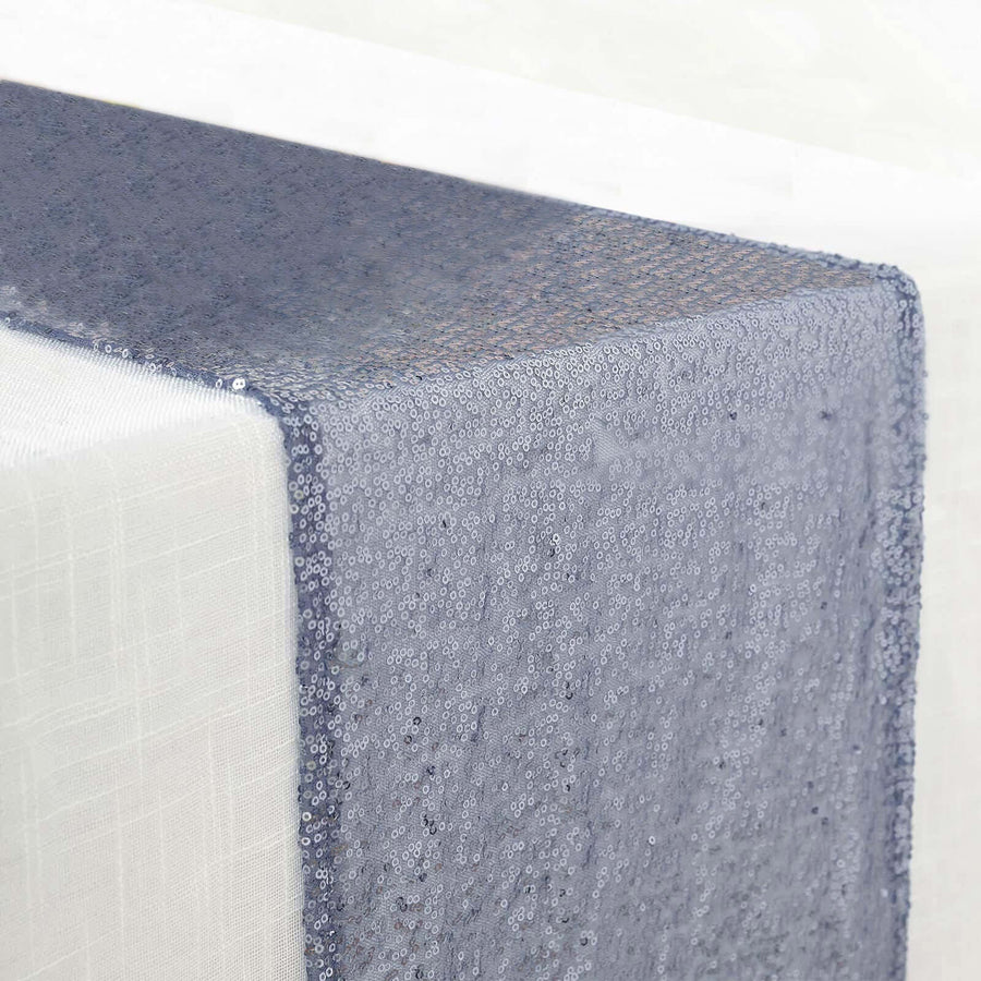 Blue sequin table runner draping elegantly over a table edge