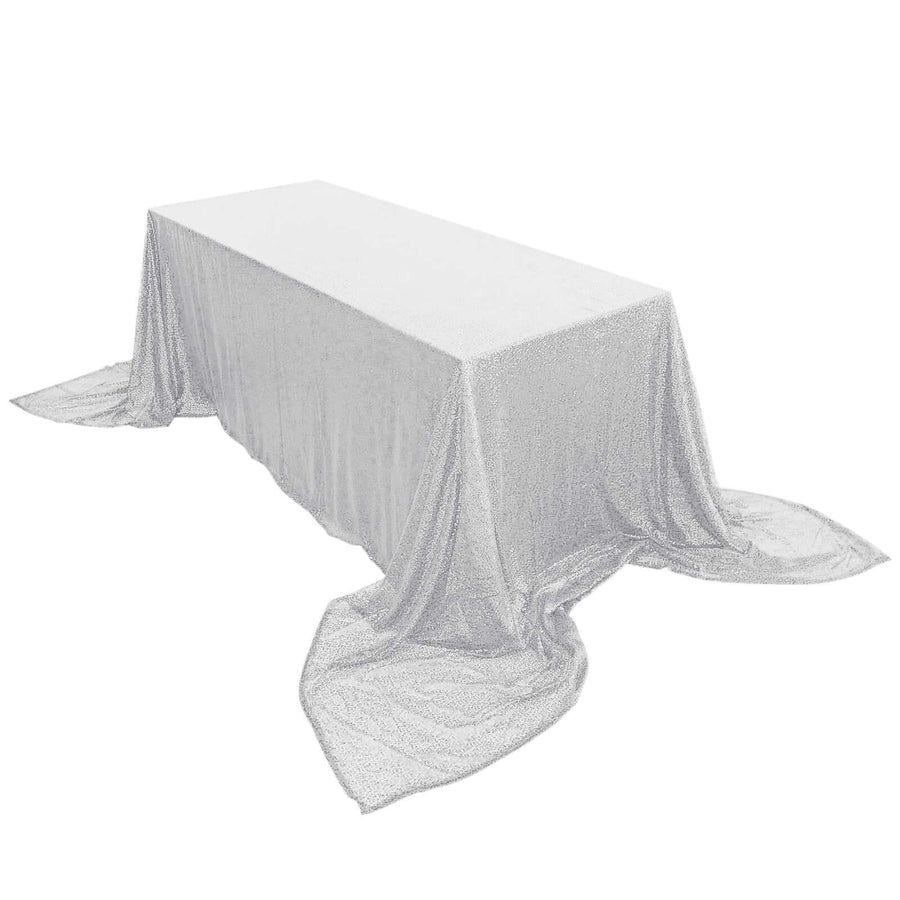 Silver glitter tablecloth draping elegantly over a rectangular table