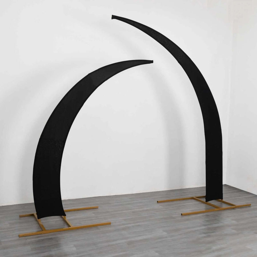 Black curved display stands on wooden bases for events or exhibitions.