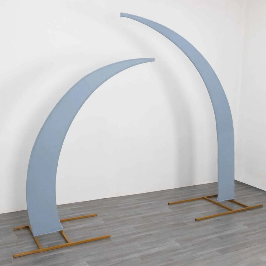 Blue curved display stands on a wooden floor against a white wall.