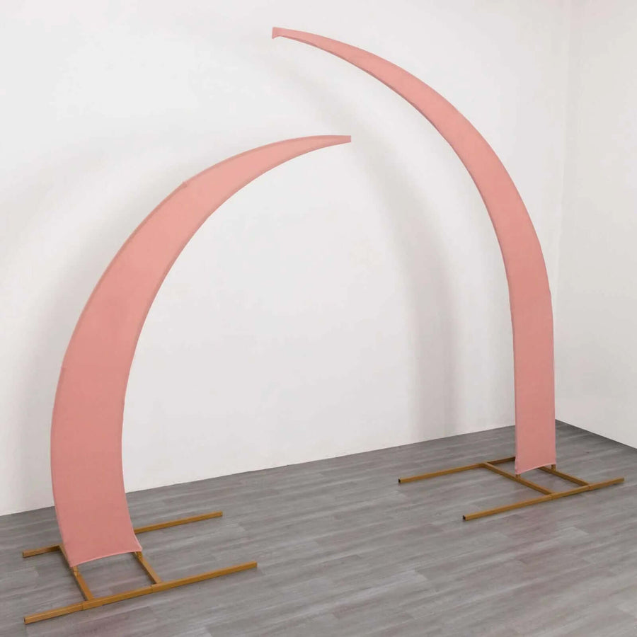 Pink arch display stands on a wooden floor.