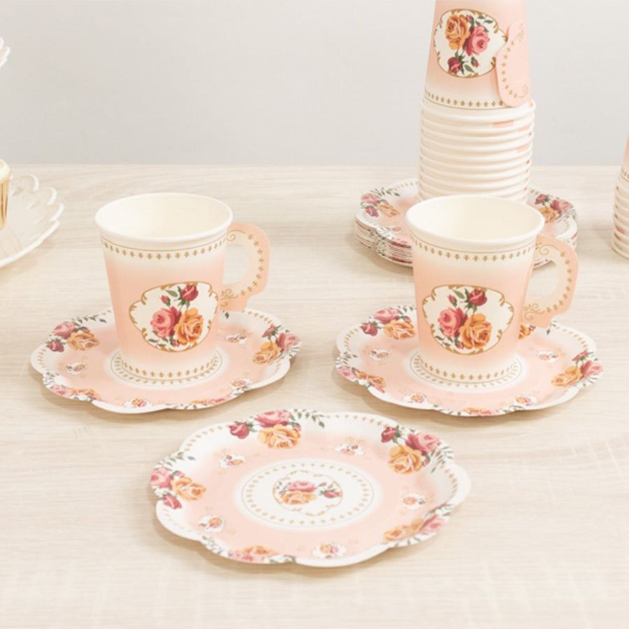 Floral pattern tea cups and plates on a wooden table.
