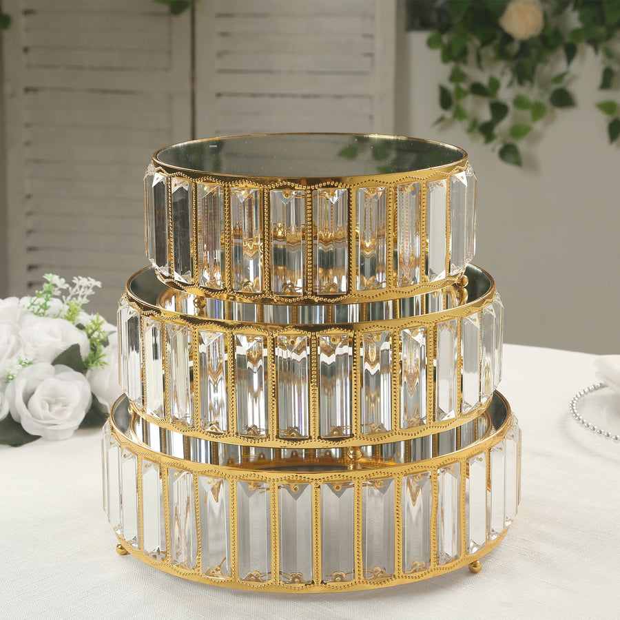 Three-tiered gold and crystal serving tray set.