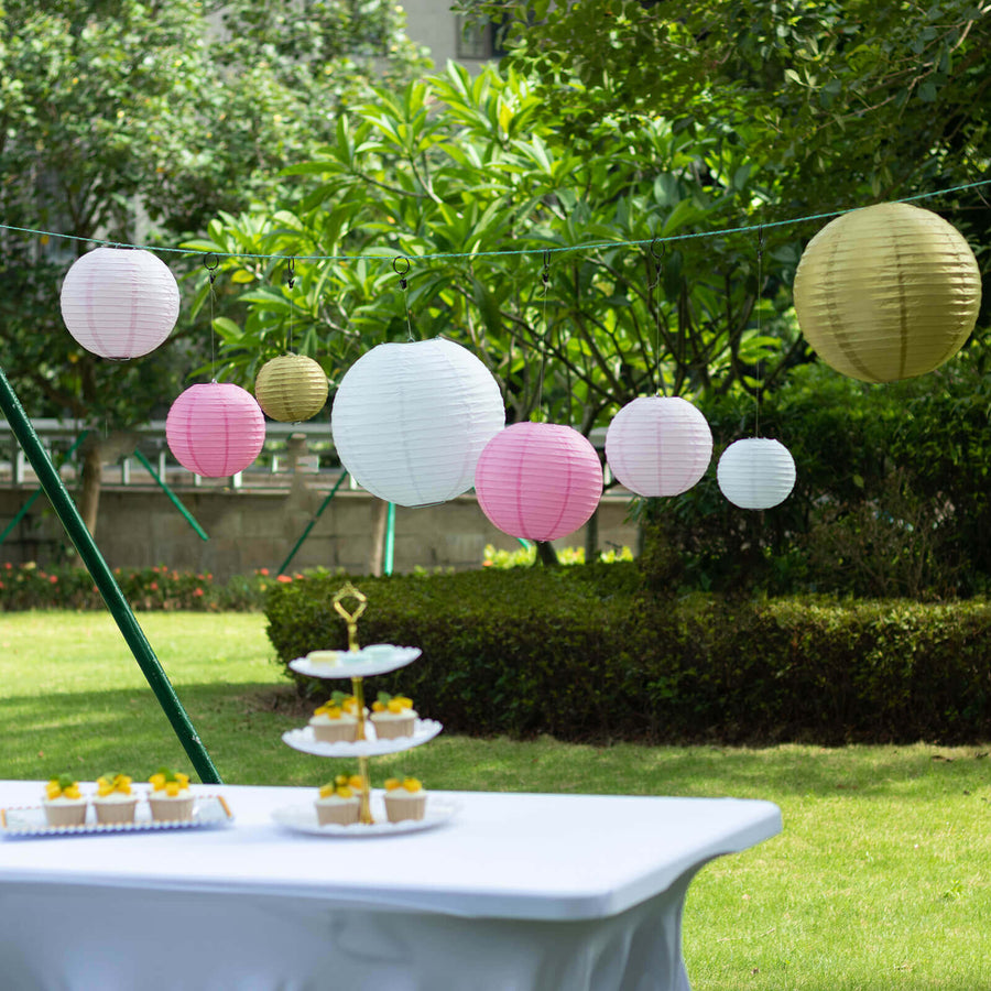 Colorful paper lanterns hanging outdoors at a festive event.