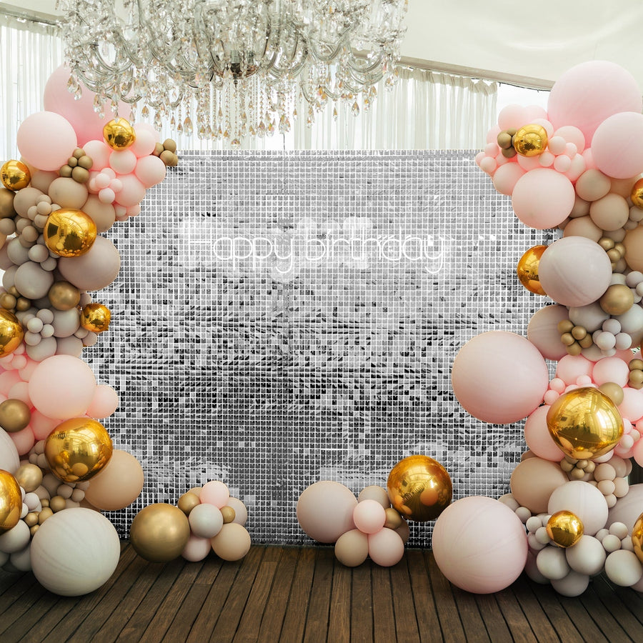 Colorful balloon arch for a birthday celebration, featuring pink and gold accents.