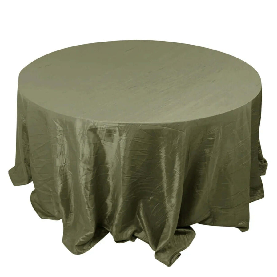 Round olive green tablecloth with elegant draping.