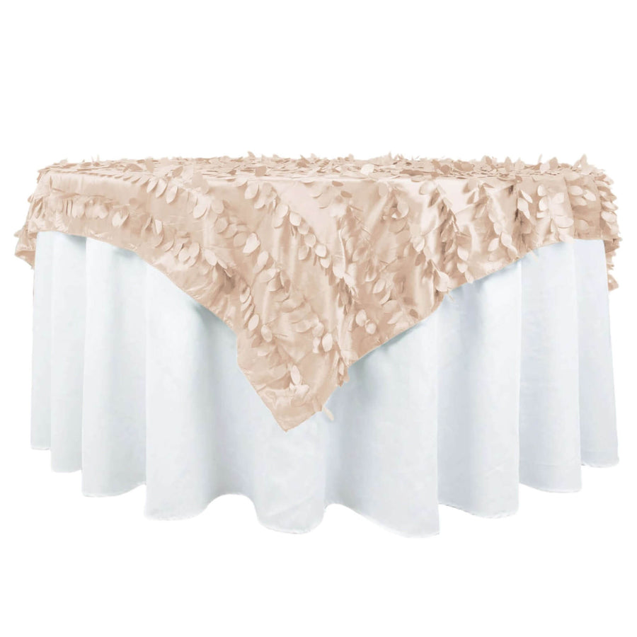 Beige tablecloth with leaf-like texture draped over a white table.