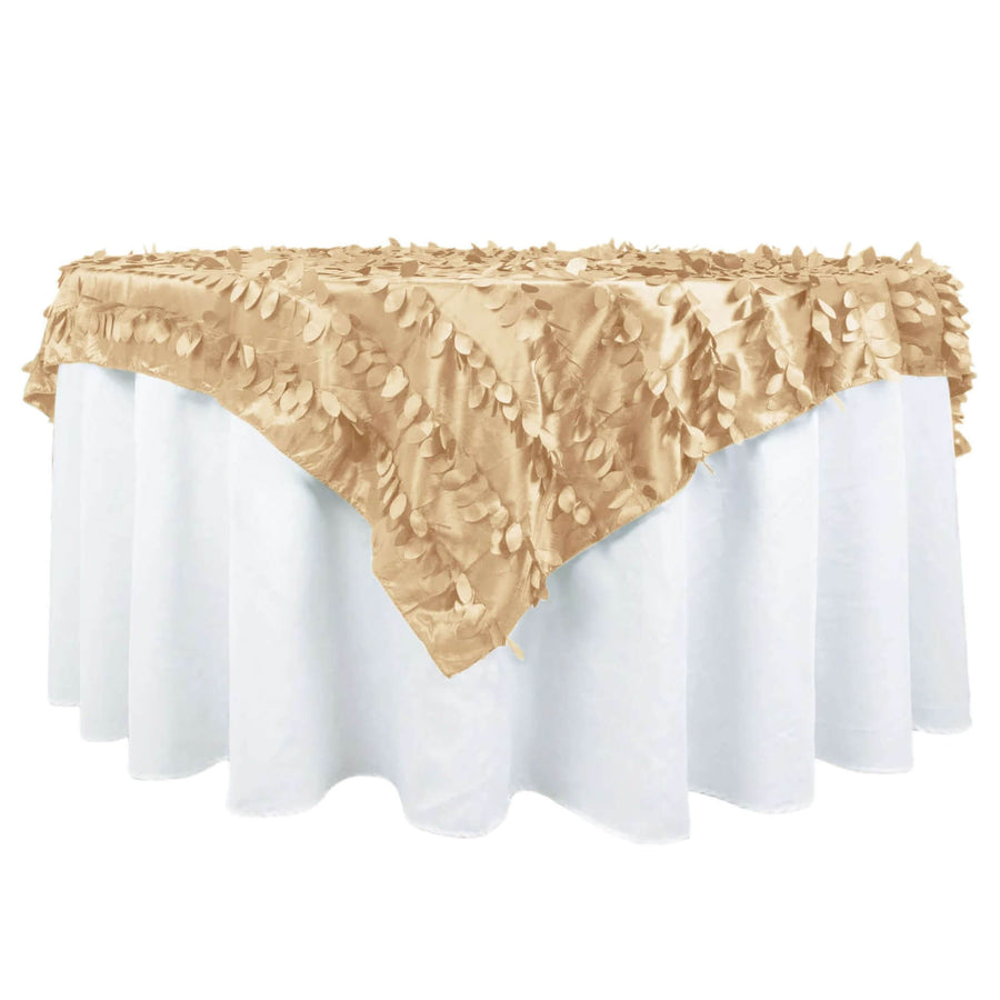 Gold leaf tablecloth draping over a white table.