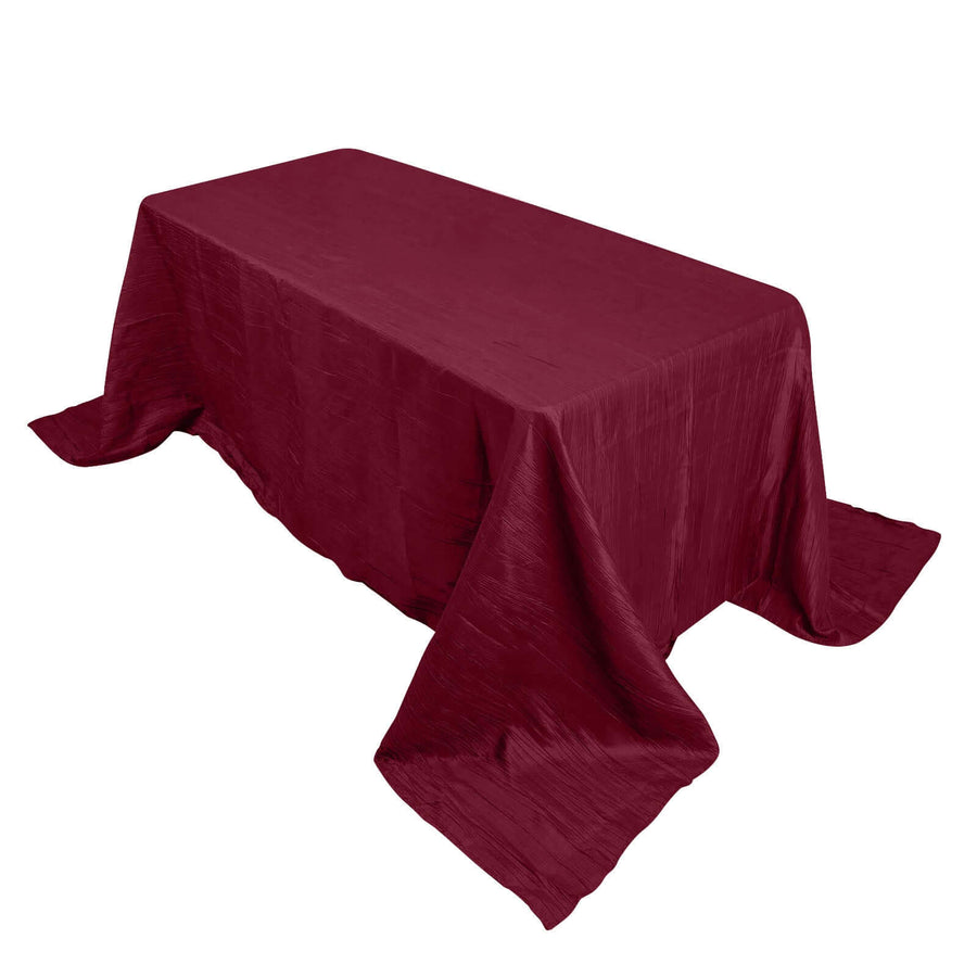 Burgundy tablecloth draped over a rectangular table