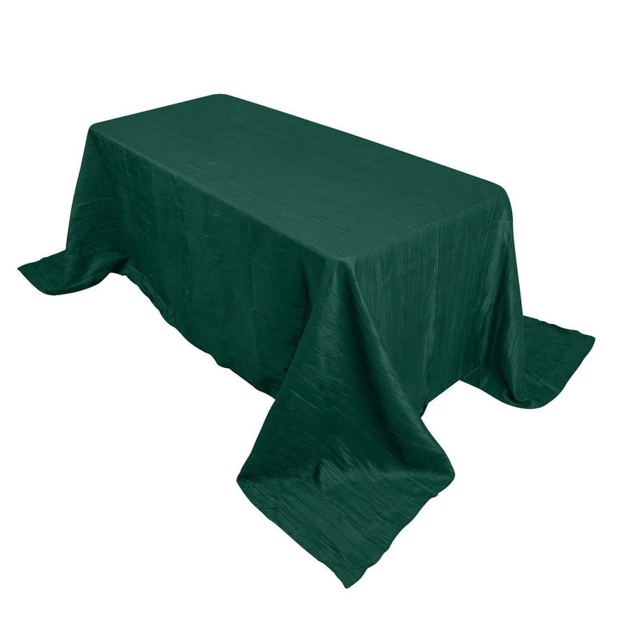 Dark green tablecloth draped over a rectangular table