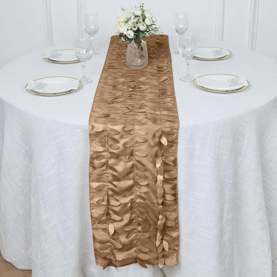 Elegant brown table runner with leaf design on a white table setting.