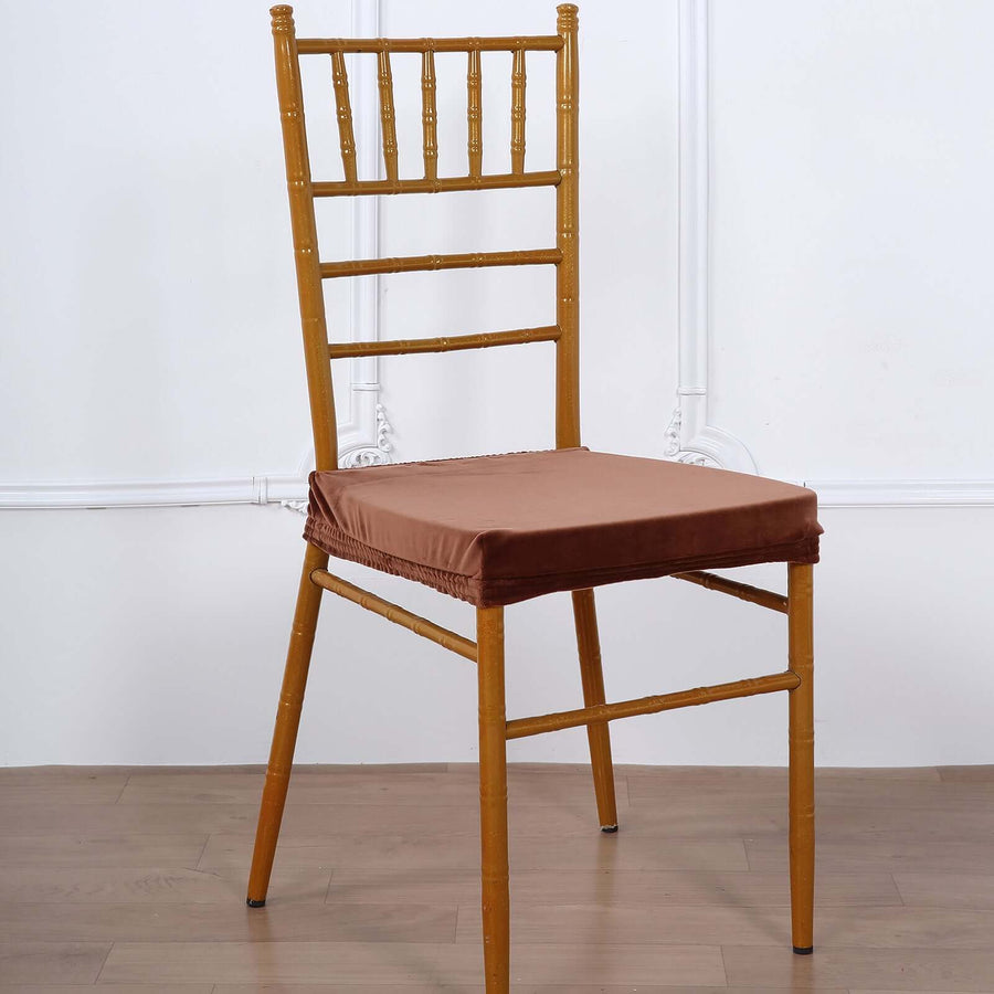 Bamboo-style chair with brown cushion on a plain background