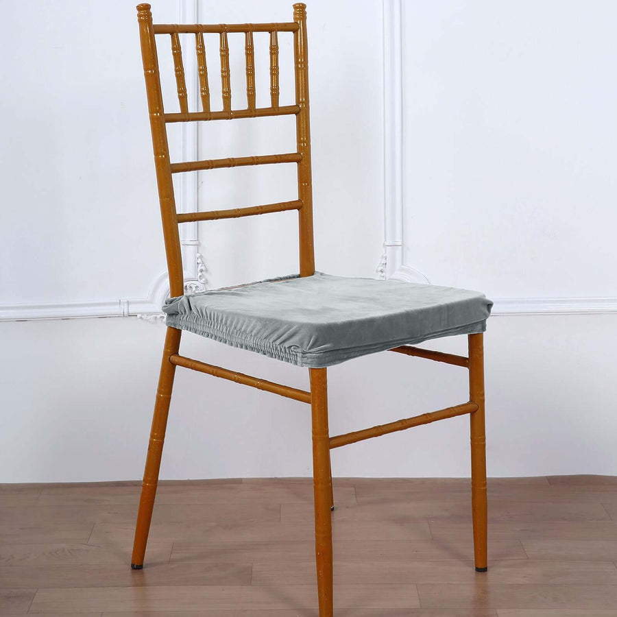 Bamboo chair with gray seat cover on a plain background