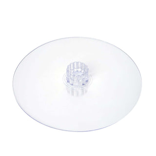 Clear round cake stand with a central support.