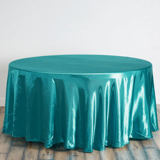 Elevate Your Event Decor with the 120" Turquoise Seamless Satin Round Tablecloth